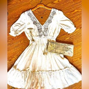 Beautiful Cream Dress with a tan crochet Brand New and fits magically!